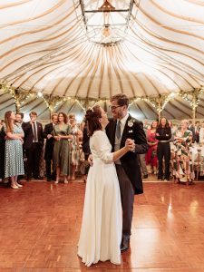 bride and groom first dance in Bohemia canvas marquee